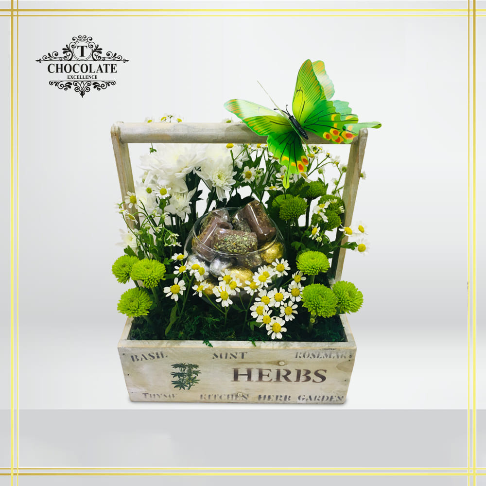 Large Wooden Basket With Fresh Flowers And Chocolate